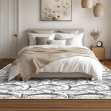 Bedroom with white bedding and a 4x6 ft area rug with hand-drawn black and white fish