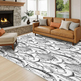 Brown leather sofa by a stone fireplace with a 4x6 ft black and white fish area rug