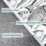 Close-up of the black and white fish print with a folded corner showing edge binding and backing