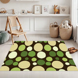 Green polka dot area rug 3x5 ft on a brown background in a playroom with wooden chair and baskets