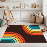 Rainbow striped 3x5 ft area rug, dark brown with red, orange and teal arcs, in a room with baskets