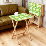Green Daisy retro TV tray set of 4, in a living room beside an olive sofa