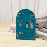 Close-up of the Cocktail Icons retro wooden bookend beside stacked magazines