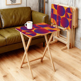 Sunset Geometric retro TV tray set of 4, in a living room beside an olive sofa