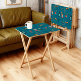Atomic Cocktail Teal retro TV tray set of 4, in a living room beside an olive sofa