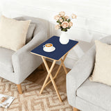Deep Indigo retro TV tray set of 4, next to a grey sofa with flowers