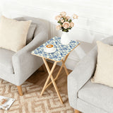 Blue Floral Toile retro TV tray set of 4, next to a grey sofa with flowers