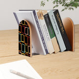 Neon Squares retro bookend holding books on a wooden desk next to a pen