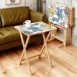 Pastel Leaves retro TV tray set of 4, in a living room beside an olive sofa