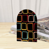 Close-up of the Neon Squares retro wooden bookend beside stacked magazines