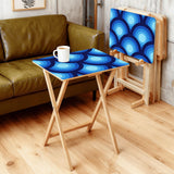 Blue Peacock Eye retro TV tray set of 4, in a living room beside an olive sofa