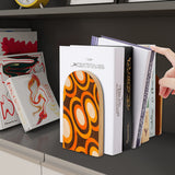 Orange Rings retro wooden bookend on a dark shelf with books
