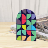 Close-up of the Geometric Tiles retro wooden bookend beside stacked magazines