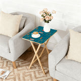 Atomic Cocktail Teal retro TV tray set of 4, next to a grey sofa with flowers