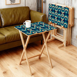 Teal Wave Circles retro TV tray set of 4, in a living room beside an olive sofa
