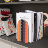 Peach Chevron retro wooden bookend on a dark shelf with books