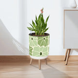 Floral 70s Retro Plant Pot with Wooden Legs: Green White Black Decor - retro plant pot