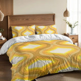 Golden yellow ogee duvet cover set on a bed with a wooden headboard and a pendant lamp