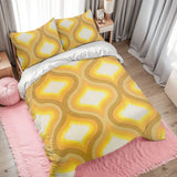 Golden yellow ogee duvet cover set on a bed with a pink rug and gray curtains