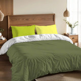 Olive green duvet cover set with lime pillowcases on a bed with a wooden headboard and a pendant lamp