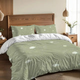 Sage green dandelion duvet cover set on a bed with a wooden headboard and a pendant lamp