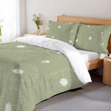 Sage green dandelion duvet cover set on a wooden bed with a flower vase on the nightstand