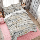 Rustic gray wood plank duvet cover set on a bed with a pink rug and gray curtains
