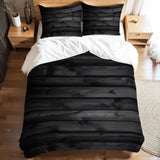 Full duvet cover set with a black wood plank print on a bed with white sheets and a wooden bedside table