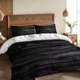 Black wood plank duvet cover set on a bed with a wooden headboard and a pendant lamp