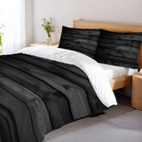 Black wood plank duvet cover set on a bed with a wooden headboard and a plant on the nightstand
