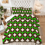 King comforter set with green, brown and white diamond shapes on a bed with a tufted white headboard
