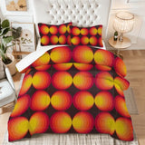 King comforter set with red, orange and yellow gradient circles on a bed with a tufted white headboard