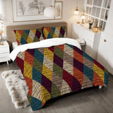Harlequin diamonds comforter set on a bed with a fur rug and a bedside lamp