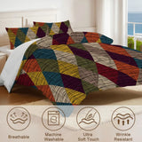 Close view of the harlequin diamonds comforter with care icons for breathable and machine washable
