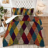 King comforter set with harlequin diamonds in mustard, red, blue and green on a bed with a tufted white headboard
