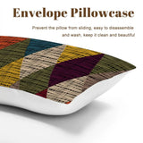 Envelope pillowcase close view in a harlequin diamonds print in mustard, red and blue