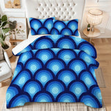 King comforter set with a blue peacock eye print on a bed with a tufted white headboard