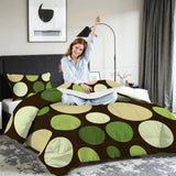 Woman stretching on a bed with the polka dots comforter set