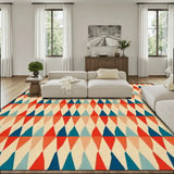 Living room with a cream sofa and a 9x12 ft area rug, red, teal and cream triangle rows