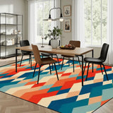 Dining room with a wooden table and chairs on a 9x12 ft area rug, orange, teal and cream zigzag diamonds