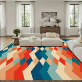 Living room with a cream sofa and a 9x12 ft area rug, orange, teal and cream zigzag diamonds