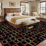 Bedroom with a wooden bed above a 9x12 ft area rug, black with colorful outlined squares
