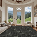 Living room with arched windows and a 9x12 ft area rug, black and gray botanical leaf line pattern
