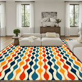 Living room with a cream sofa and a 9x12 ft area rug, orange, teal and navy vertical waves
