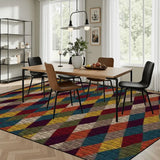Dining room with a wooden table and chairs on a 9x12 ft area rug, burgundy, blue and mustard harlequin diamonds