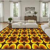 Living room with a cream sofa and a 9x12 ft area rug, brown with yellow and orange flower shapes