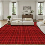 Living room with a cream sofa and a 9x12 ft area rug, red and black plaid