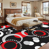Bedroom with a wooden bed above a 9x12 ft area rug, black with red, white and gray circles