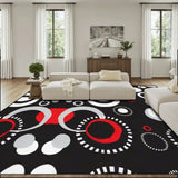 Living room with a cream sofa and a 9x12 ft area rug, black with red, white and gray circles