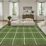 Living room with a cream sofa and a 9x12 ft area rug, green with a cream window-pane line grid